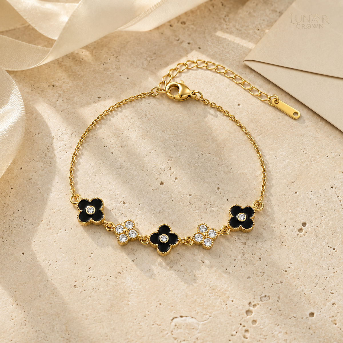 Black Four-Petal Flower Bracelet — Gold Tone