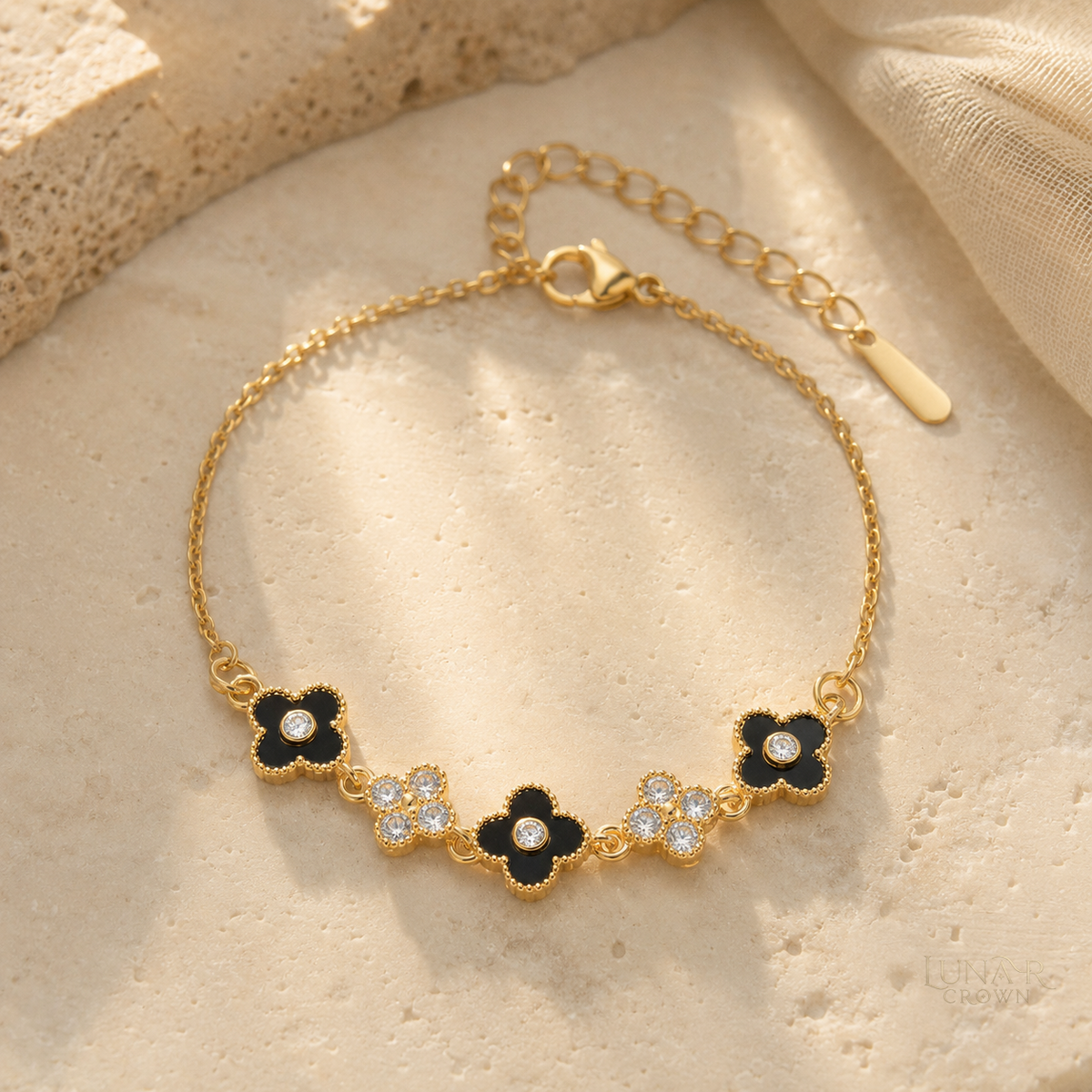 Black Four-Petal Flower Bracelet — Gold Tone