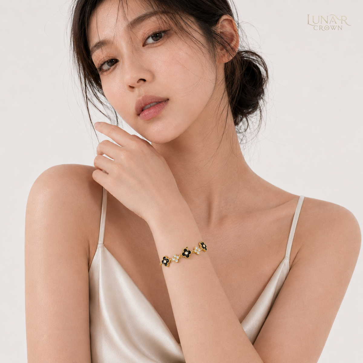Black Four-Petal Flower Bracelet — Gold Tone