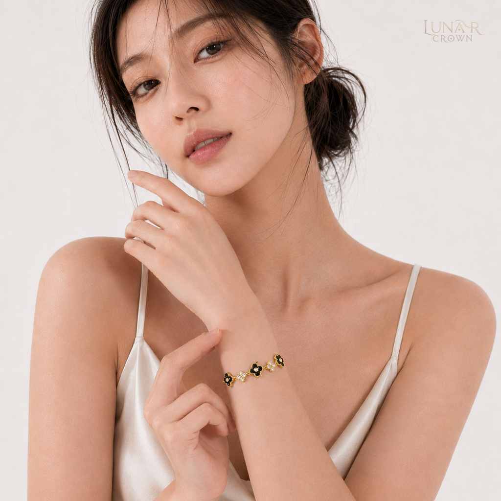 Black Four-Petal Flower Bracelet — Gold Tone