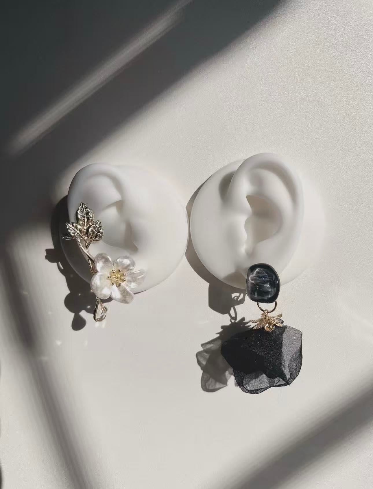 Floral earrings in light and shadow