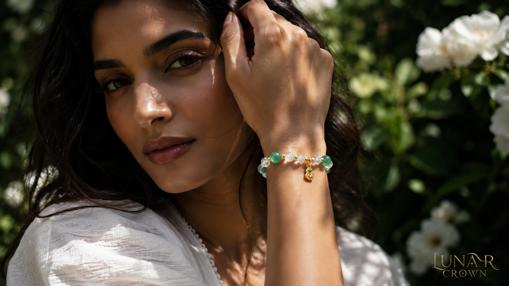 Green and clear bracelet in a garden